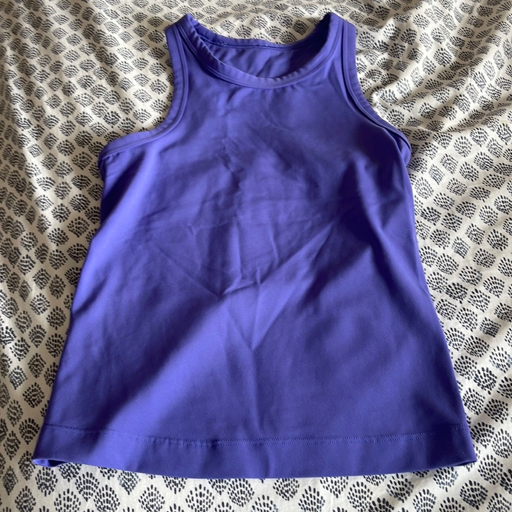 This is a lululemon athletic top. It is great quality. Barely worn too.